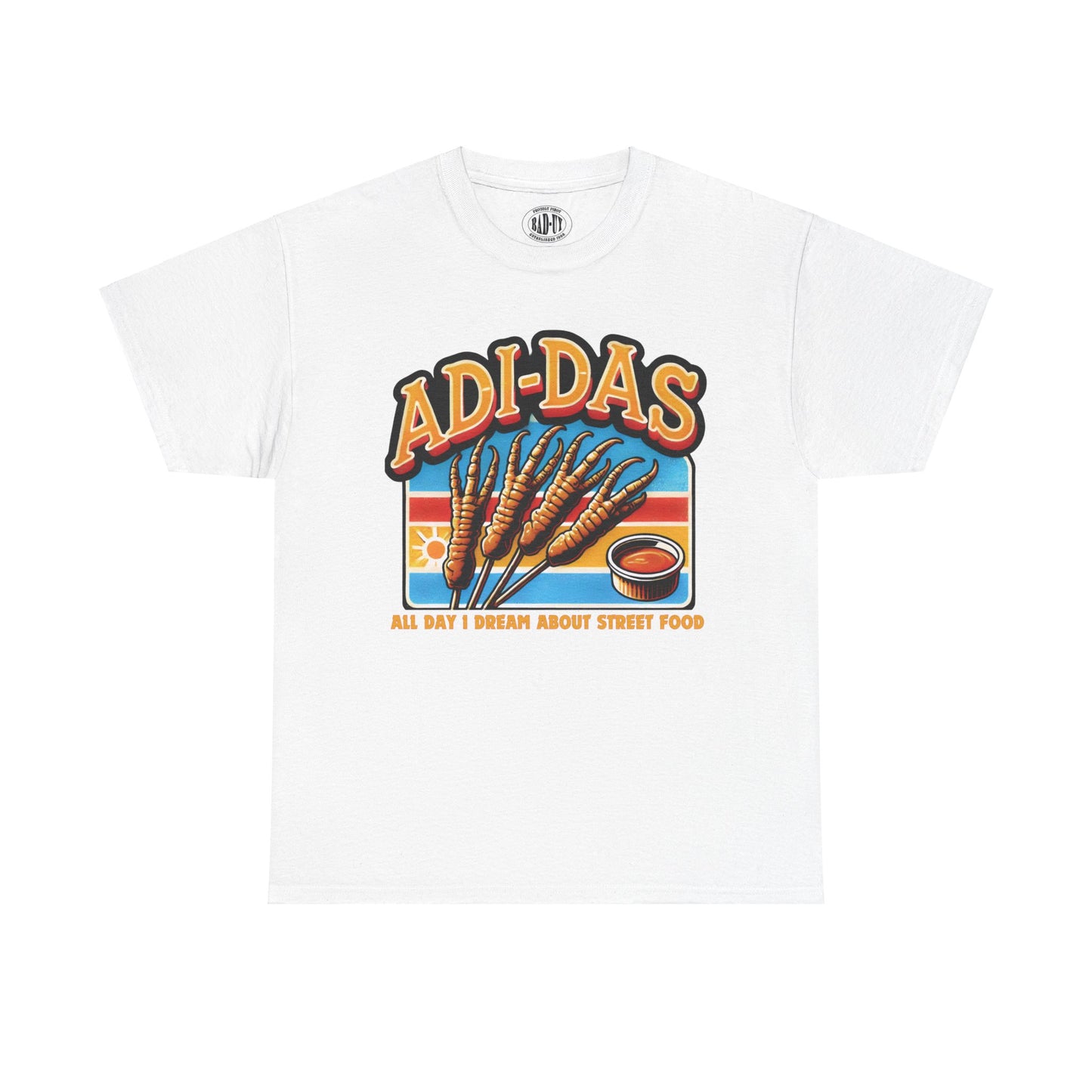 "ADI-DAS' white t-shirt featuring a fun street food pun with grilled chicken feet and a dipping sauce, inspired by Filipino street food. Text reads 'All Day I Dream About Street Food' with a retro-style design.